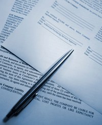 retracting biro and two pages from a written contract